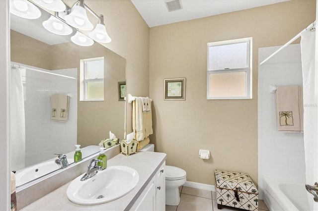 full bathroom with tile patterned flooring, vanity, tub / shower combination, and toilet