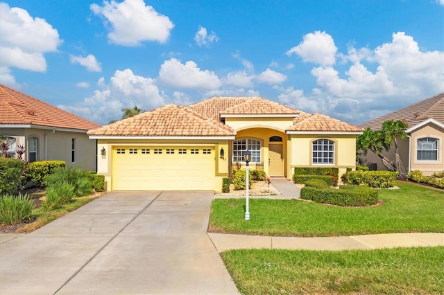 mediterranean / spanish-style house with a front yard and a garage