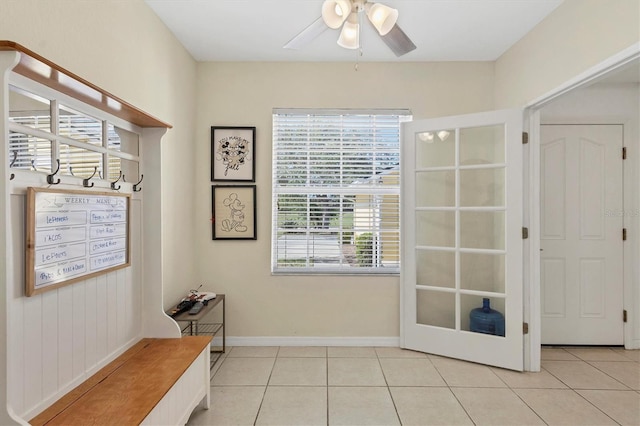 doorway to outside with ceiling fan, french doors, and light tile patterned floors