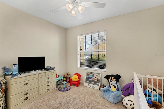 rec room with light carpet and ceiling fan