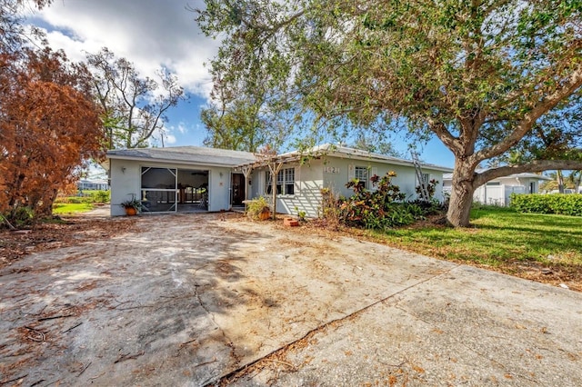 ranch-style house with a front lawn