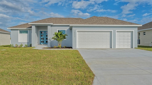 view of front of house featuring a garage and a front yard