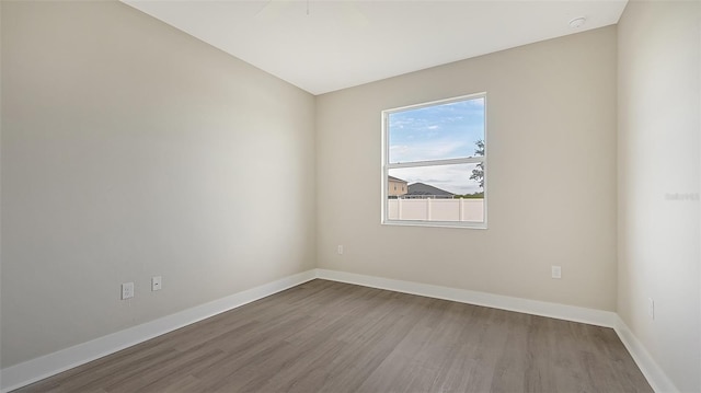 empty room featuring wood-type flooring