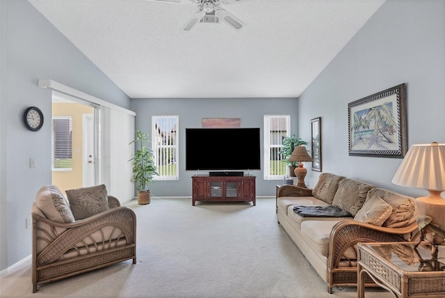 carpeted living room featuring ceiling fan, a textured ceiling, and vaulted ceiling