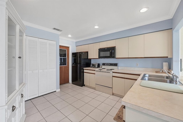 kitchen featuring black appliances, ornamental molding, sink, and cream cabinets