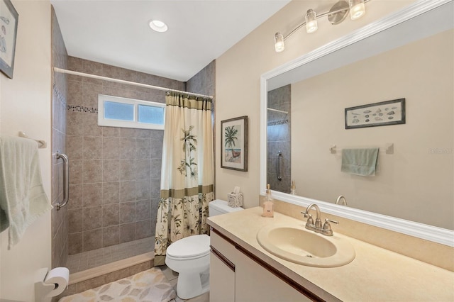 bathroom featuring a shower with shower curtain, vanity, toilet, and tile patterned flooring