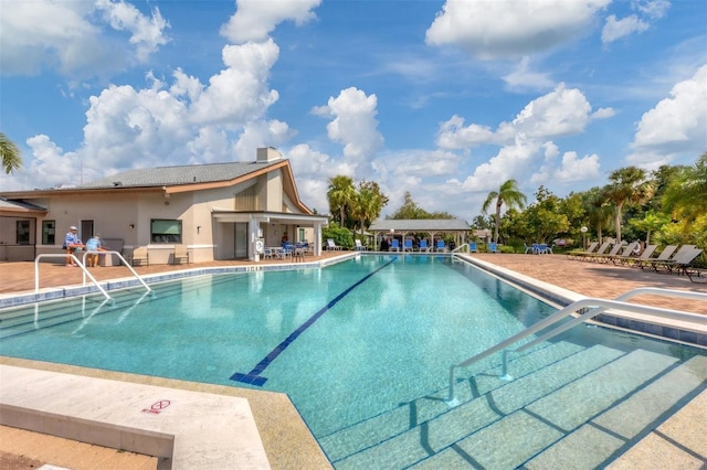 view of pool featuring a patio