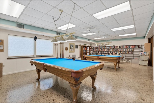 game room with a paneled ceiling and pool table