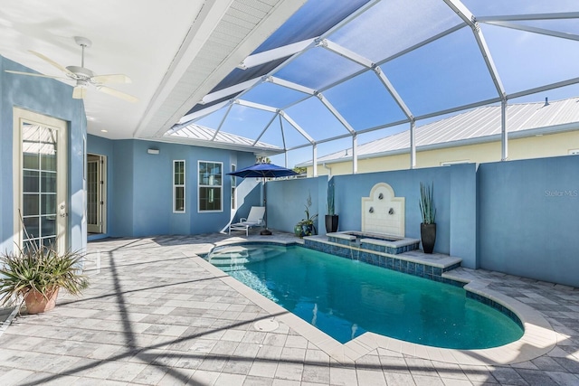 view of pool with a patio, a hot tub, ceiling fan, and a lanai