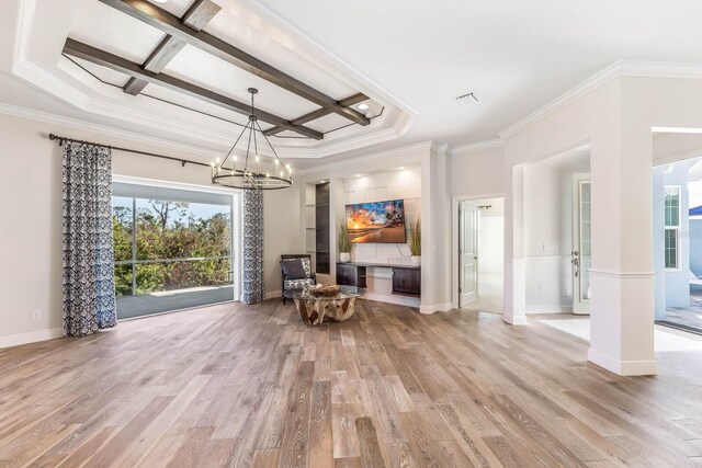 sitting room with light wood-style floors, coffered ceiling, and crown molding