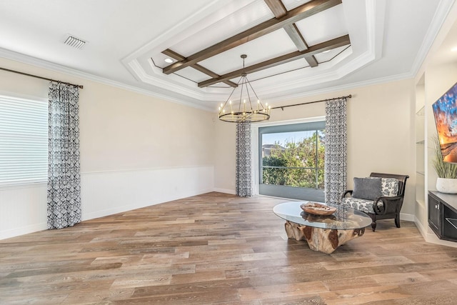 sitting room featuring light wood-style flooring, visible vents, coffered ceiling, and a chandelier