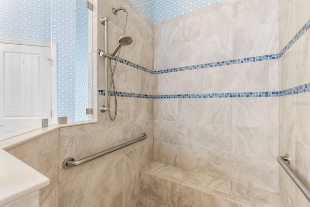 full bathroom featuring tiled shower