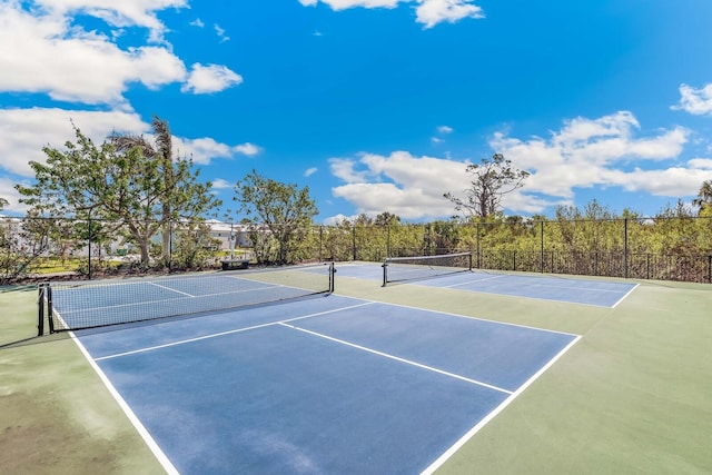 view of sport court with fence