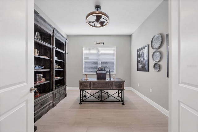 office with light hardwood / wood-style flooring