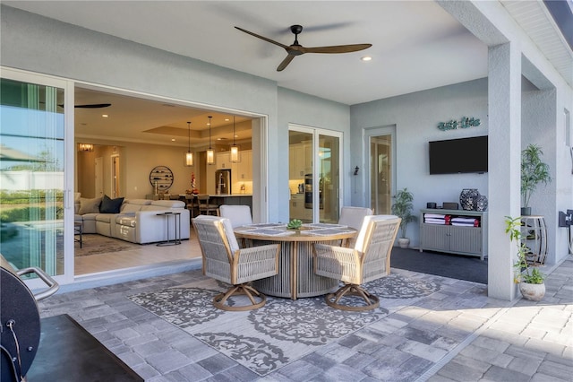 view of patio / terrace featuring ceiling fan