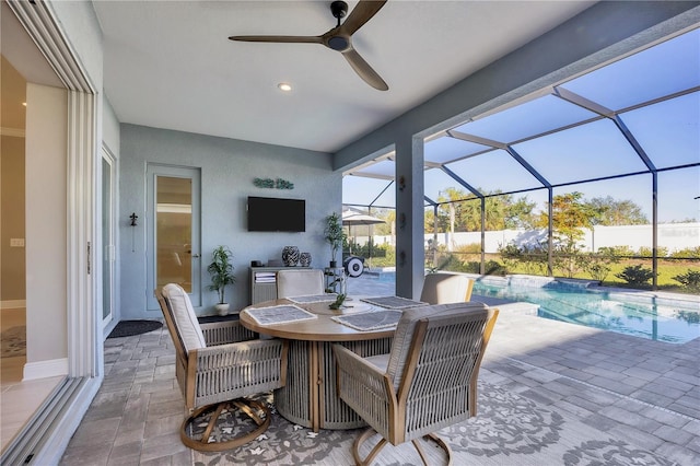 view of patio / terrace with glass enclosure and ceiling fan