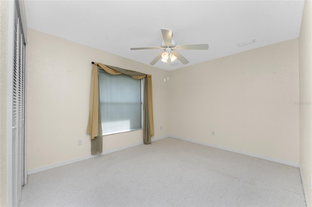 unfurnished bedroom featuring ceiling fan and light carpet