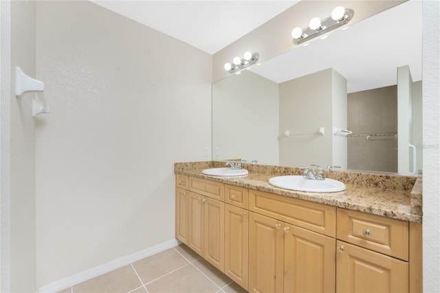 bathroom with tile patterned flooring and vanity