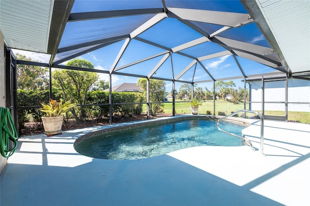 view of swimming pool with a lanai and a patio