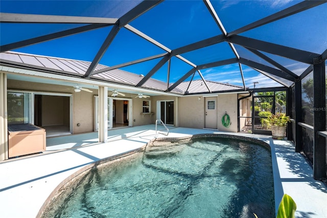 view of pool with a lanai, a patio area, and ceiling fan