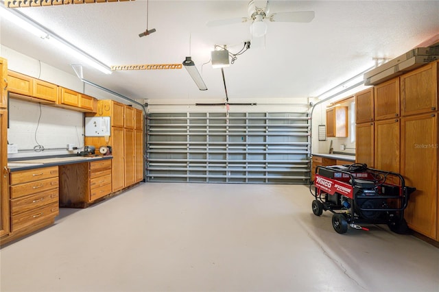 garage featuring a garage door opener and ceiling fan