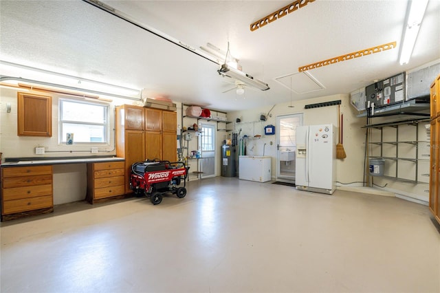 garage with electric water heater and white refrigerator with ice dispenser