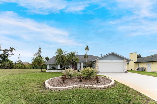 ranch-style house featuring central AC unit, a front yard, and a garage