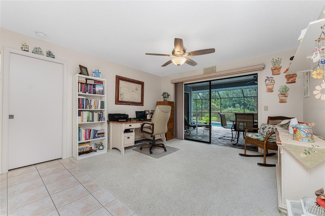 home office featuring ceiling fan and light colored carpet