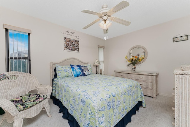 bedroom with light carpet and ceiling fan