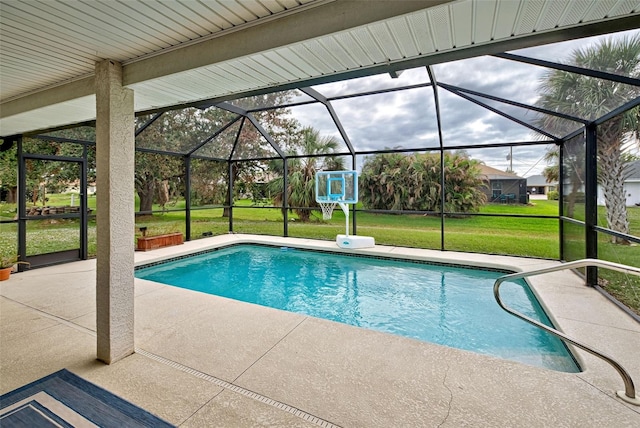 view of swimming pool with a patio, glass enclosure, and a lawn