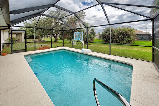 view of pool featuring glass enclosure, a patio area, and a lawn