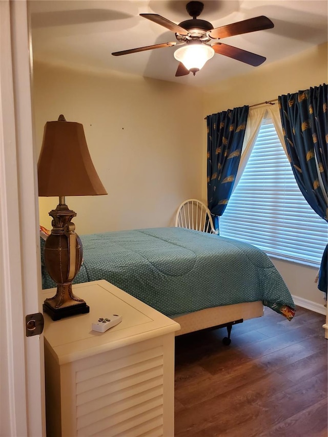 bedroom featuring hardwood / wood-style flooring and ceiling fan