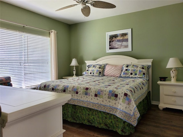 bedroom with dark hardwood / wood-style floors and ceiling fan