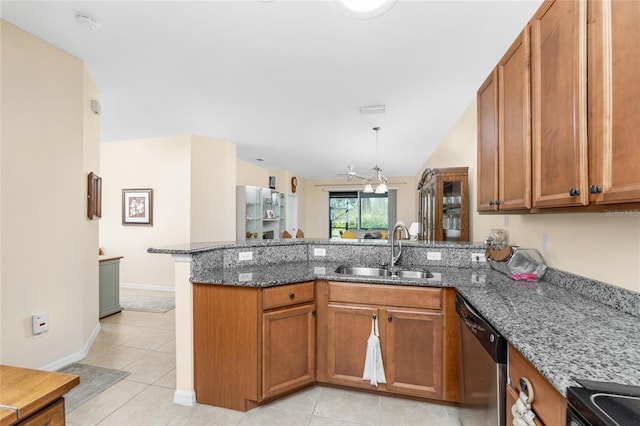 kitchen with dishwasher, stone countertops, kitchen peninsula, and sink