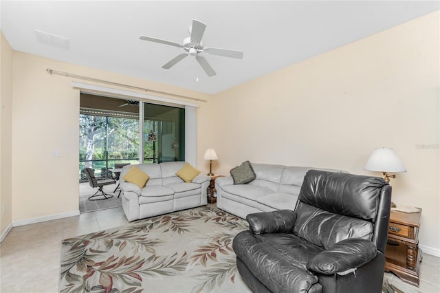 tiled living room featuring ceiling fan