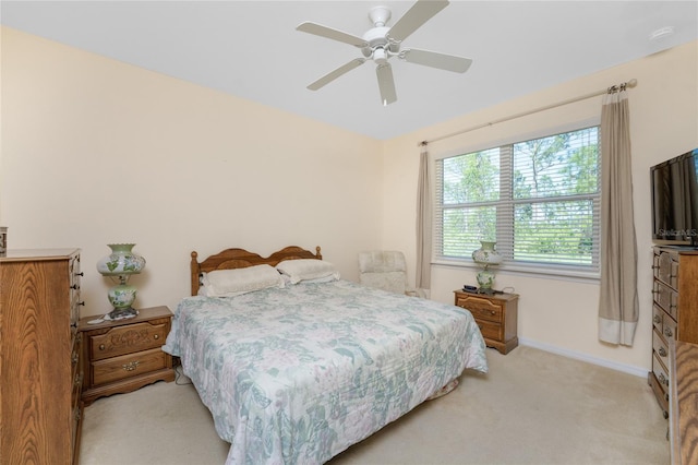 bedroom featuring ceiling fan and light colored carpet