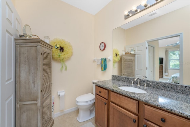 bathroom with tile patterned floors, vanity, and toilet