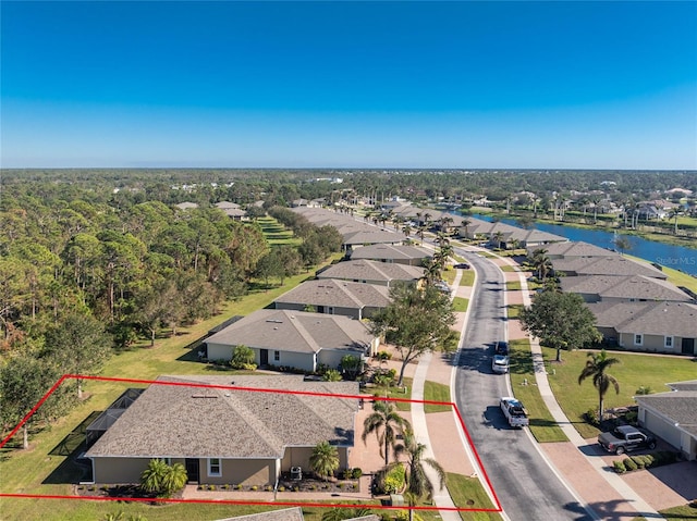 birds eye view of property featuring a water view