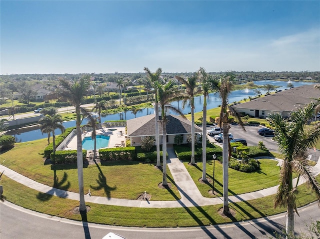 birds eye view of property with a water view