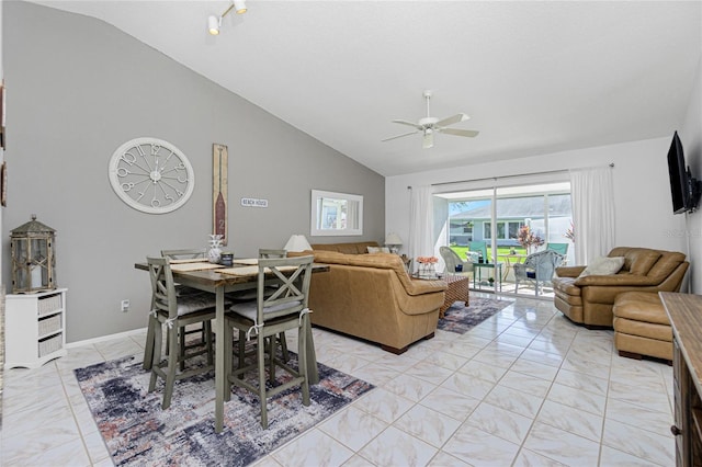 living room with ceiling fan and vaulted ceiling