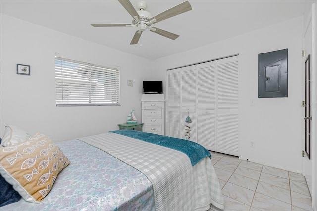 tiled bedroom with ceiling fan, electric panel, and a closet