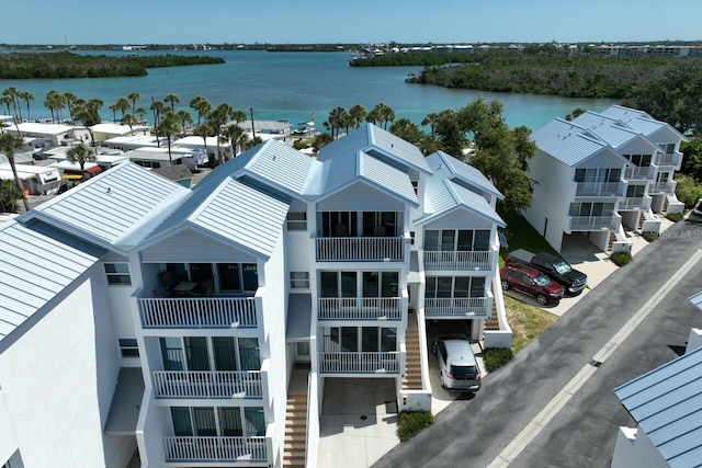 birds eye view of property with a water view