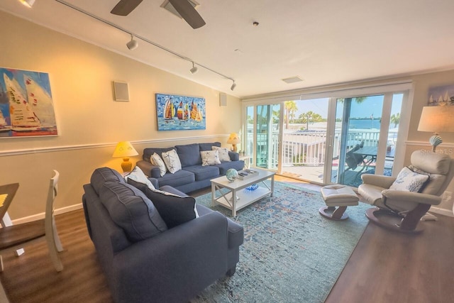 living room featuring hardwood / wood-style floors, ceiling fan, lofted ceiling, and track lighting