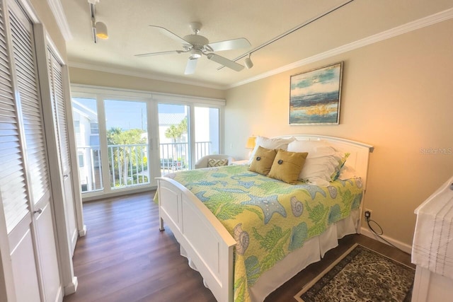 bedroom featuring access to exterior, track lighting, ceiling fan, crown molding, and dark hardwood / wood-style floors