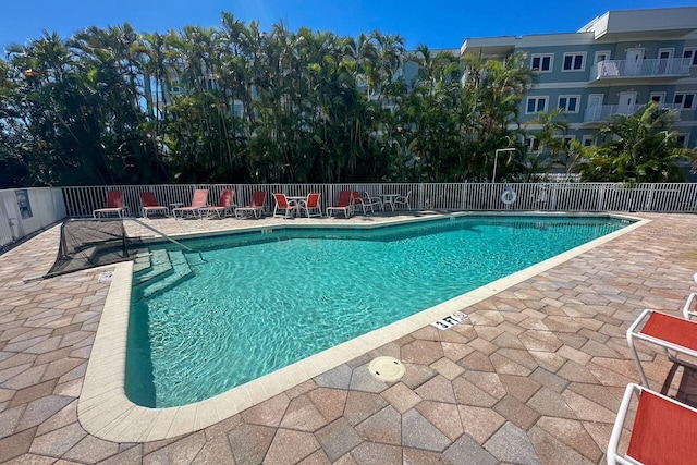 view of swimming pool with a patio