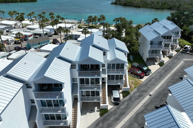 birds eye view of property featuring a water view