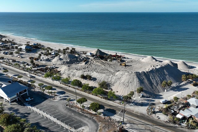 birds eye view of property featuring a view of the beach and a water view