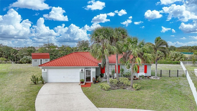 view of front facade with a garage and a front lawn