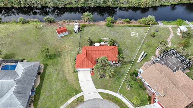 birds eye view of property with a water view