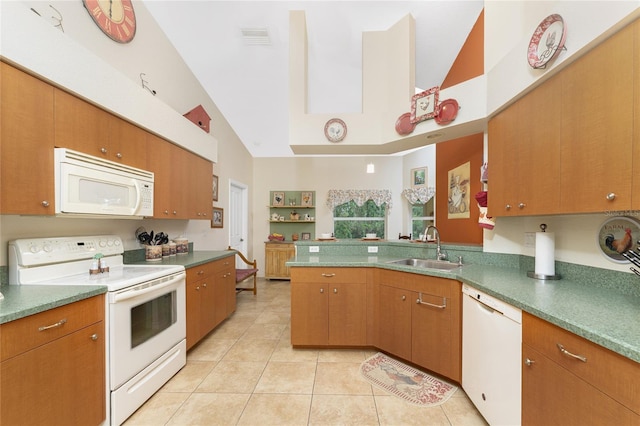 kitchen featuring white appliances, light tile patterned floors, visible vents, a sink, and vaulted ceiling